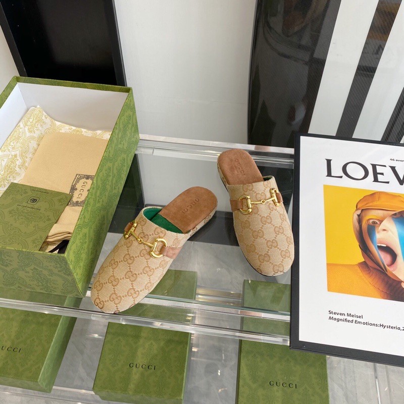 Giày sục nữ mũi tròn da in logo đế bằng gucci Gc GG