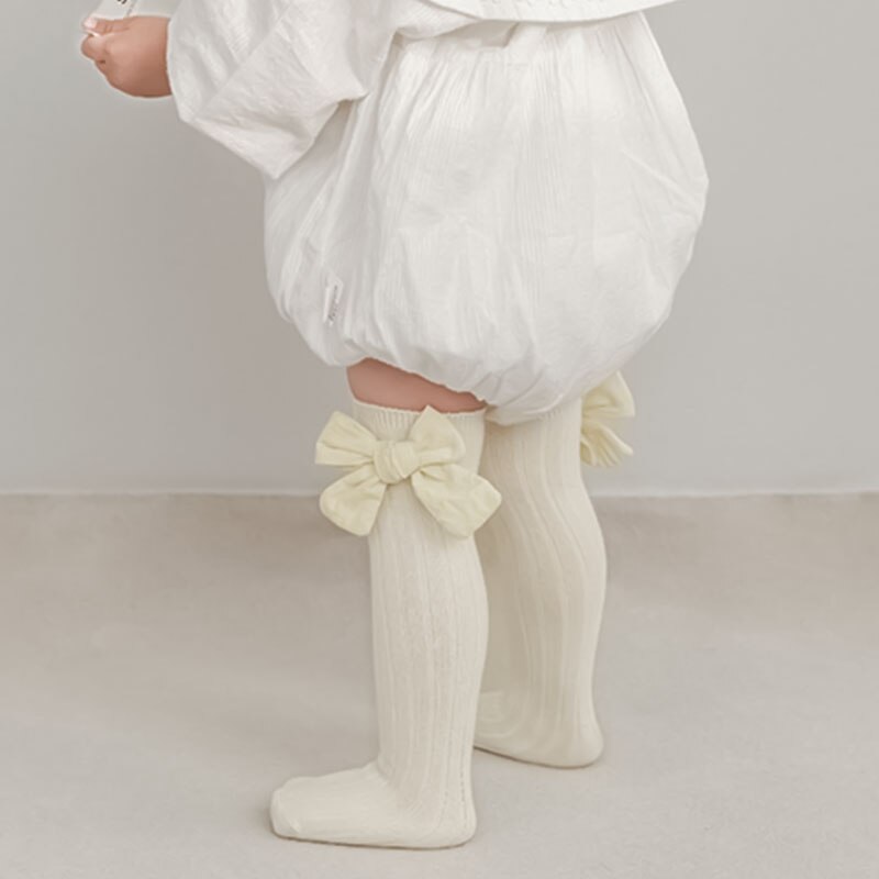 Đôi tất chân cotton dài đính nơ dễ thương cho bé