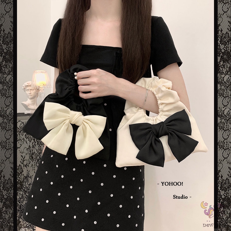 Túi xách cầm tay thiết kế xếp nếp gắn nơ thời trang Hàn Quốc cho trẻ em - người lớn