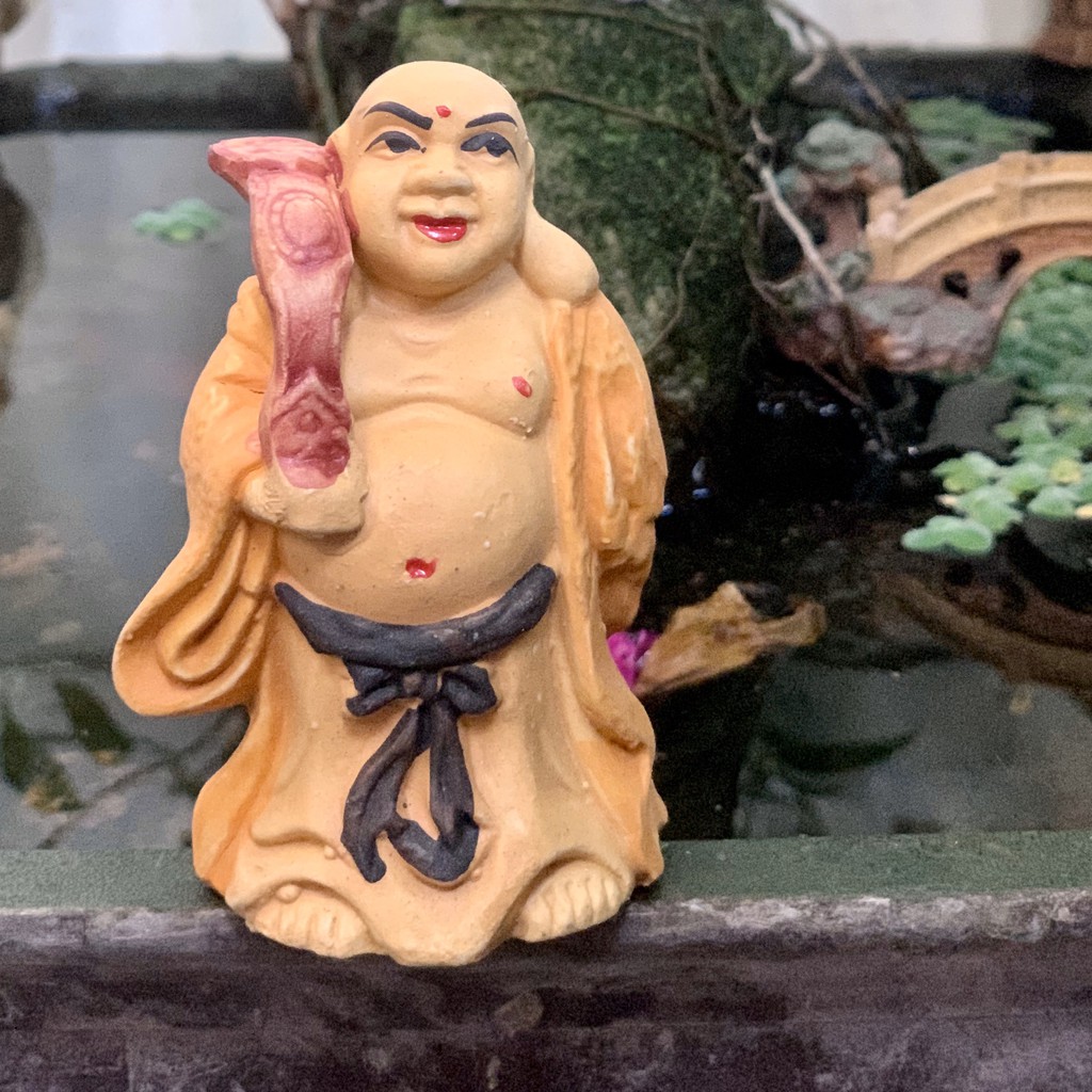 Tượng gốm Phật Di Lạc đứng gốm sứ.