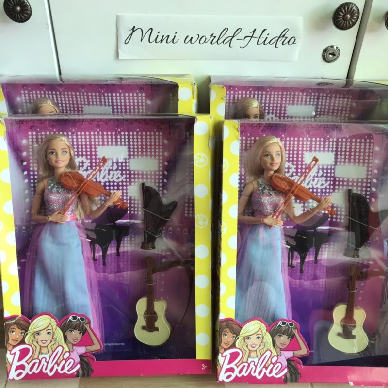 Búp bê Barbie chơi nhạc cụ dân chính hãng.