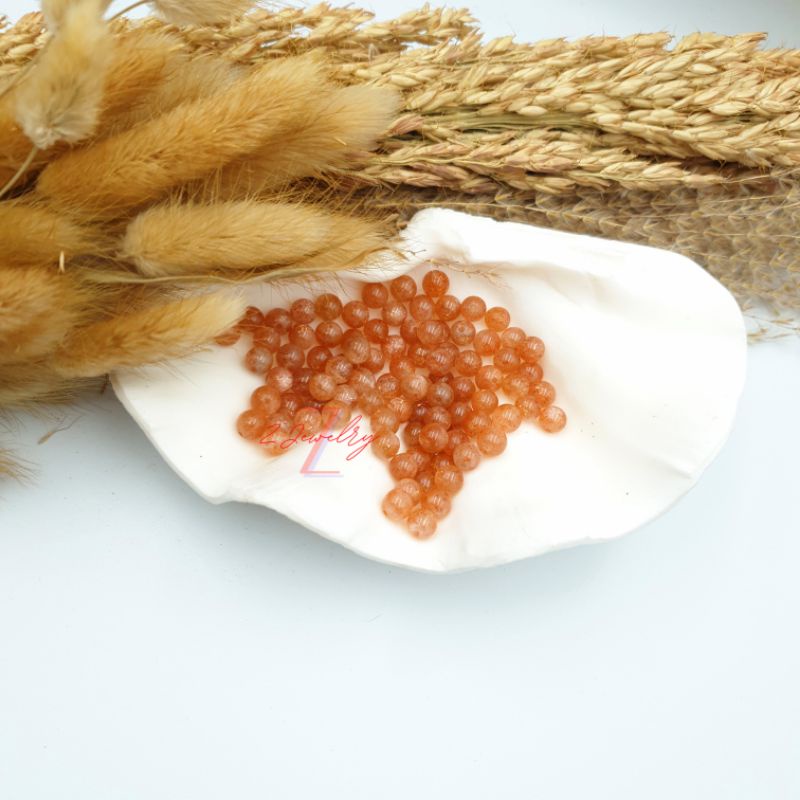 1 hạt đá màu ánh cam Mặt Trời
