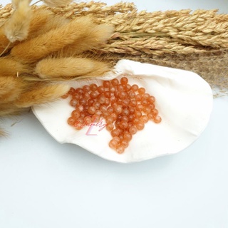 1 hạt đá màu ánh cam Mặt Trời