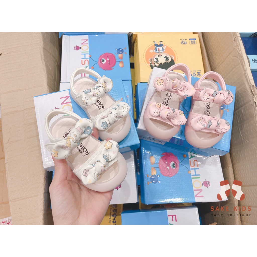 Sandal tập đi chống vấp phối nơ hình Bông hoa mũi có đế chống trơn trượt kiểu dáng Hàn Quốc mới nhất M865