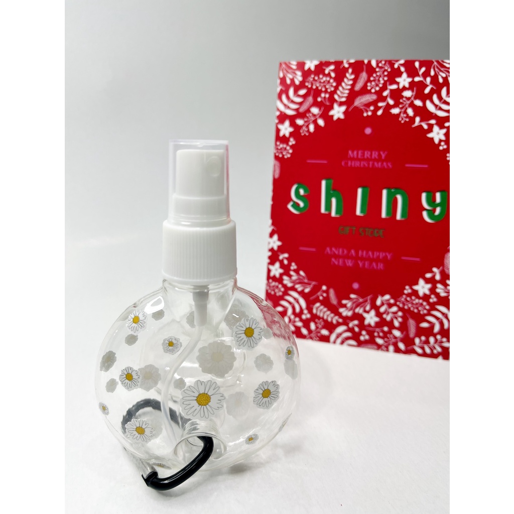 Bình xịt hình tròn 50ml tặng kèm sticker hoa cúc và móc treo tiện dụng