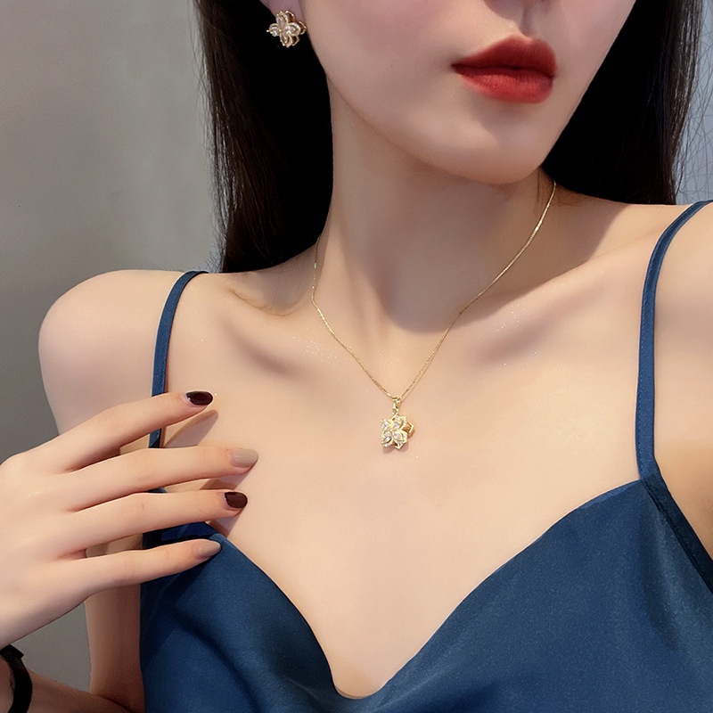 Dây chuyền/ Hoa tai/ Nhẫn mặt hoa bốn cánh đính đá zircon xoay được thời trang mùa hè dành cho bạn nữ