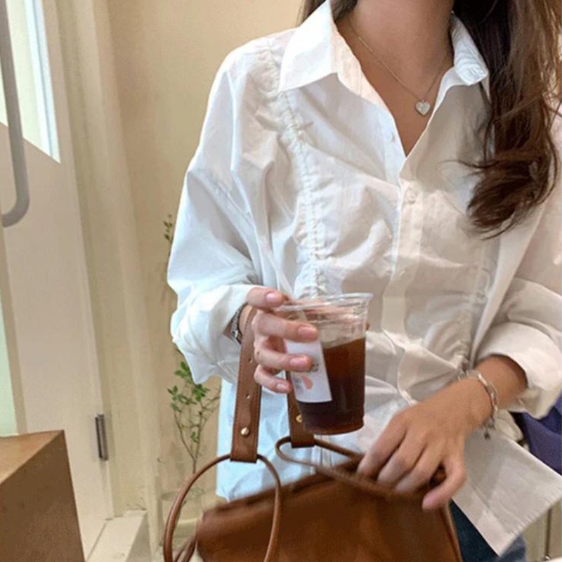 Áo sơ mi IELGY dài tay màu trắng phối dây rút xếp chồng thời trang Hàn Quốc cho nữ