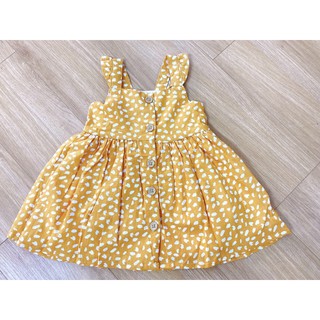 Váy prinmark nền vàng chấm trắng cực xinh cho bé