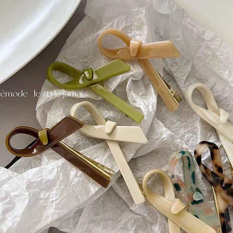 Kẹp mái nơ xà cừ