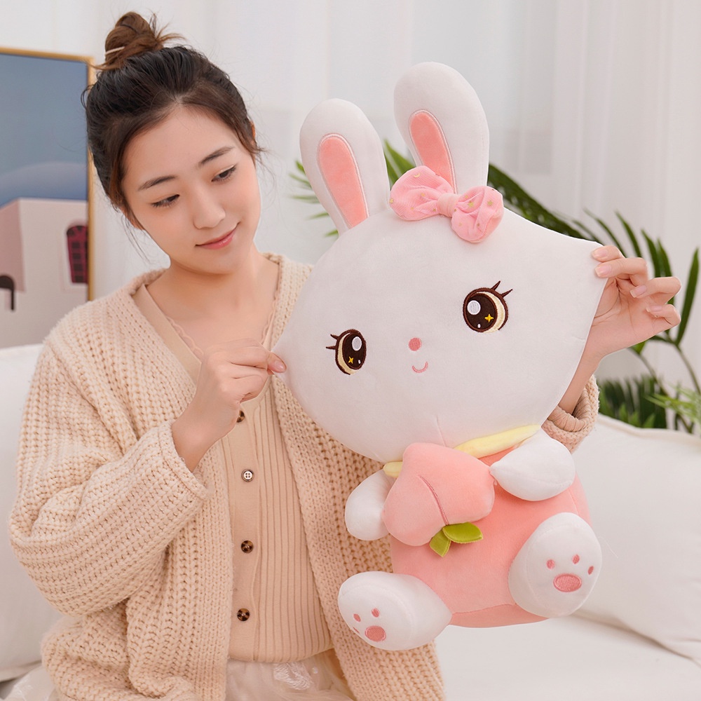 CÓ SẴNGấu bông thỏ trắng ôm đào dễ thương kích thước 40-55cm