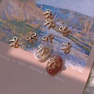 Charm nơ trang trí móng màu vàng,bạc lẻ 1 cái