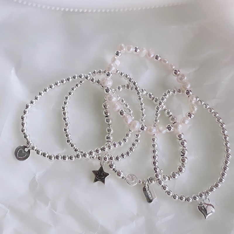 Vòng tay dây cước charm mạ bạc ngọc trai nhân tạo
