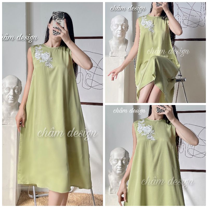Váy suông lụa xanh cốm cao cấp, thân váy có gắn nơ trắng thêu. Hàng thiết kế tại shop