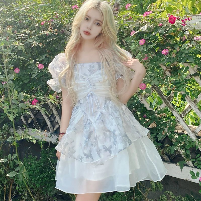 Váy đầm Công chúa voan xòe họa tiết hồ điệp thắt nơ màu trắng xám mặc hè loại đẹp