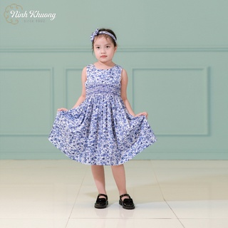 Đầm bé gái smock khoét lưng nơ sau ninh khương