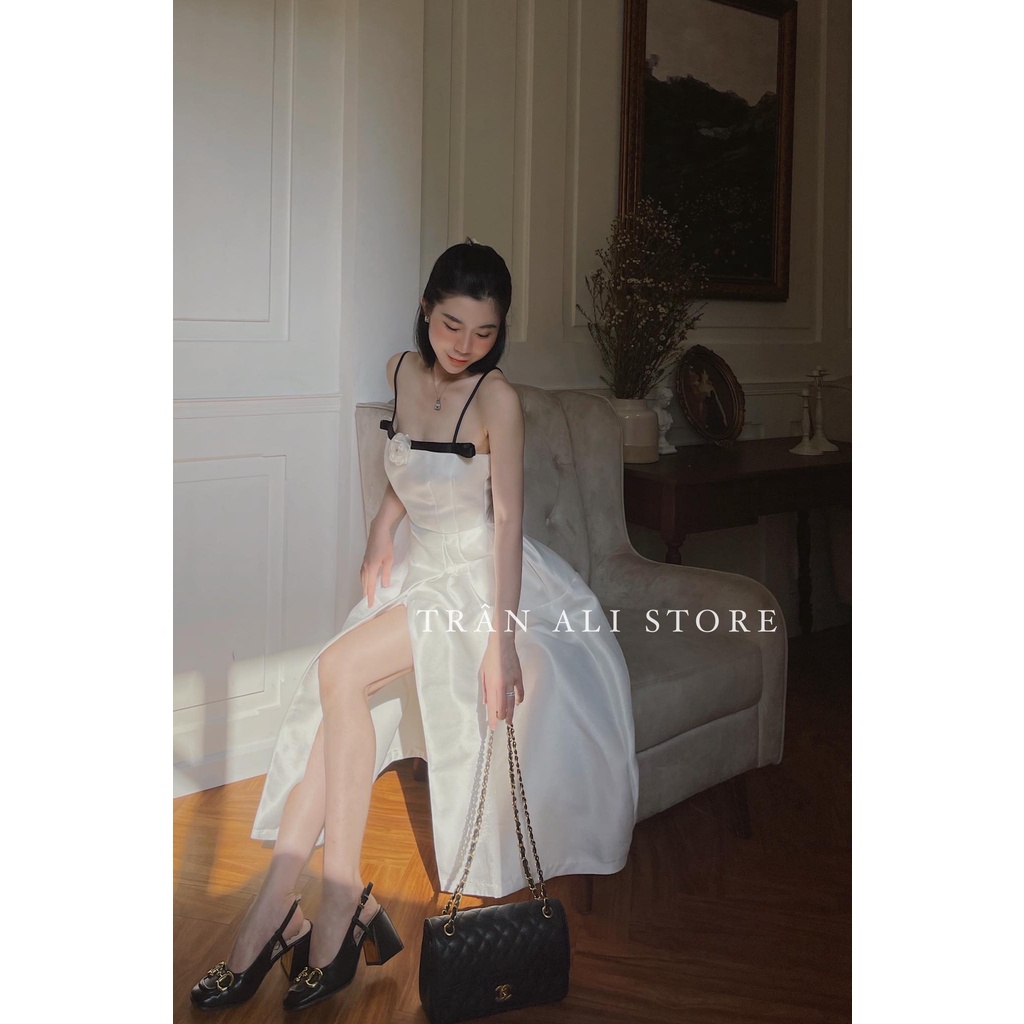 Đầm váy nữ dạ tiệc hai dây kết nơ xẻ tả màu trắng tinh khôi, sang chảnh.