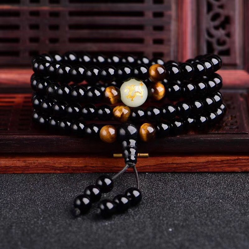 Vòng tay chuỗi hạt đá onyx obsidian đen phát sáng 108 hạt khắc hình 12 con giáp