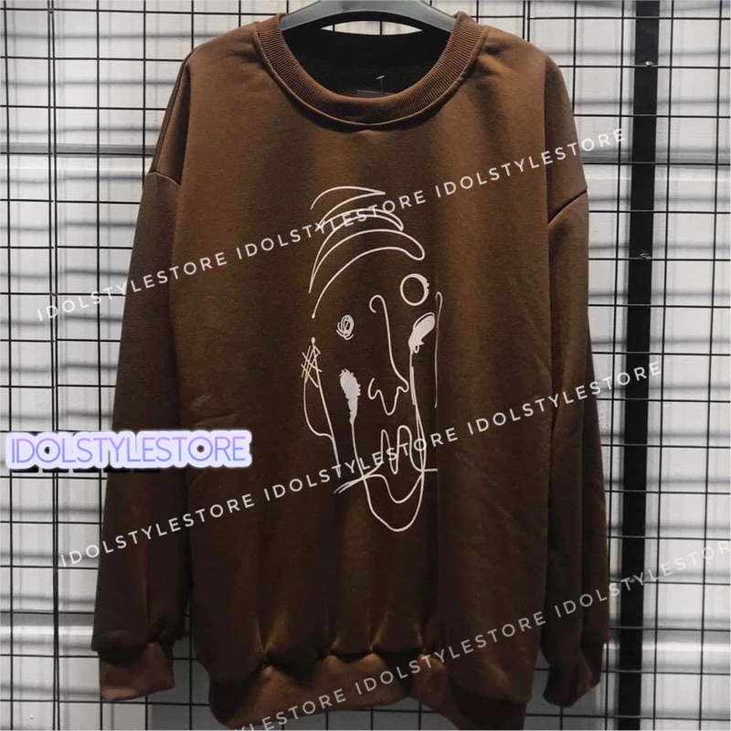 Áo nỉ nâu hình vẽ của V BTS