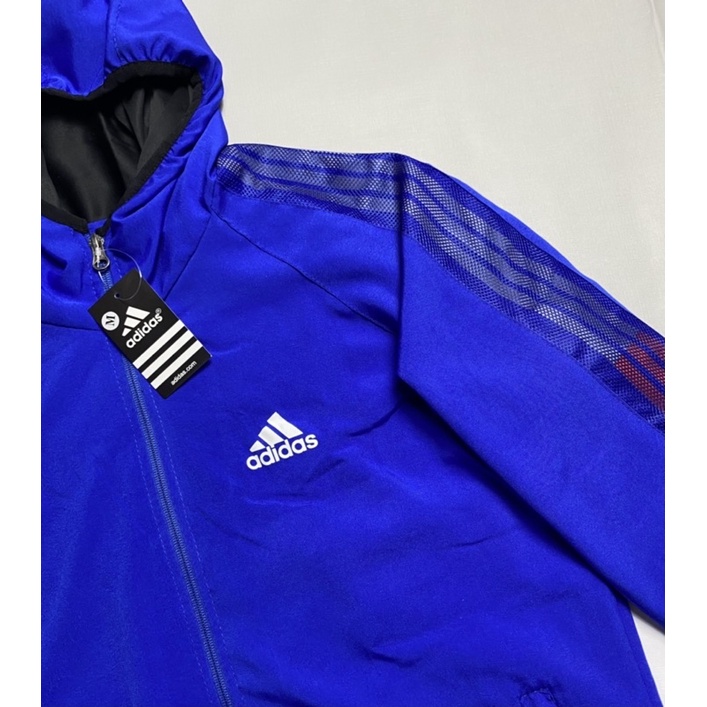 Áo Khoác Dù Nhẹ Nam Nữ 2 Lớp Có Mũ Chống Nắng Màu Trắng 3 Sọc Adidas Thể Thao áo khoác gió Nam Nữ Form Xuông Có Dây Rút