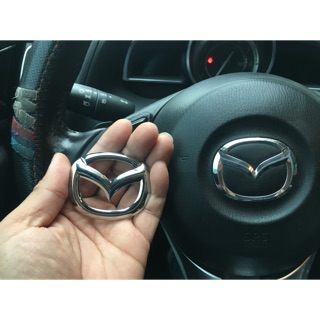 Logo ốp mazda dán đè logo vô lăng cũ