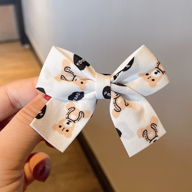 Kẹp tóc hình nơ màu đỏ sữa cà phê xinh xắn cho bé gái