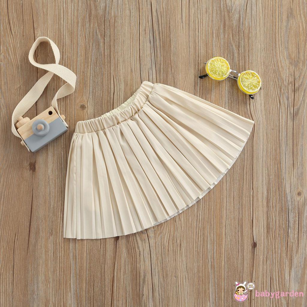 Chân váy da xếp ly lưng thun co giãn màu trơn dành cho bé gái