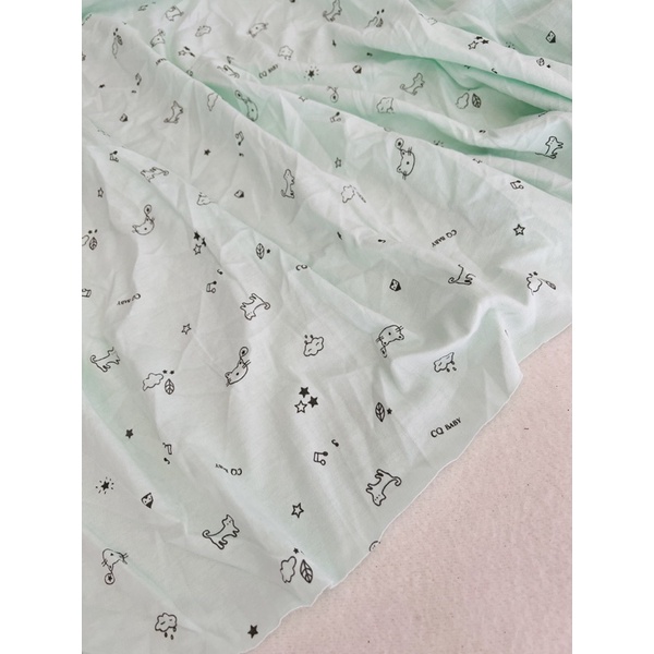 Vải thun cotton 2c hình baby nền xanh ngọc nhạt