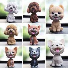Chú chó lắc lư để trên xe, bàn làm việc