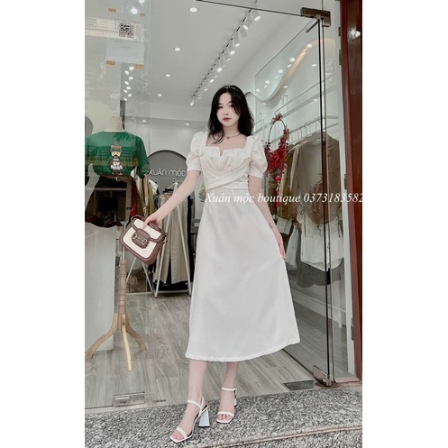 Đầm midi xanh bơ cổ vuông tay phồng chéo ngực dây vai