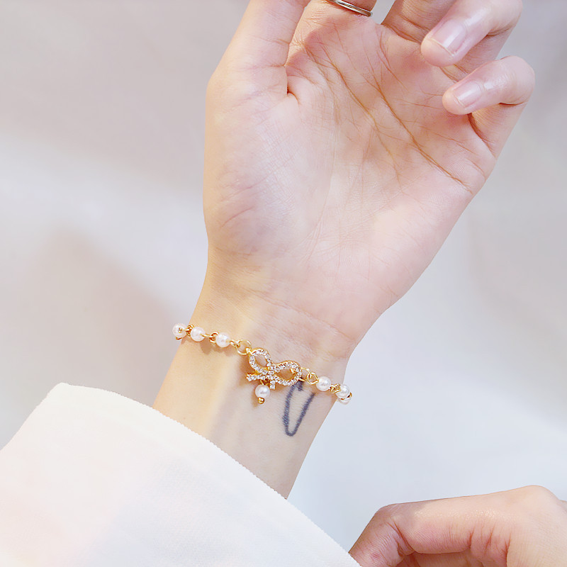 Vòng Tay Hình Nơ Đính Ngọc Trai Lấp Lánh Thời Trang Hàn Quốc Cho Nữ