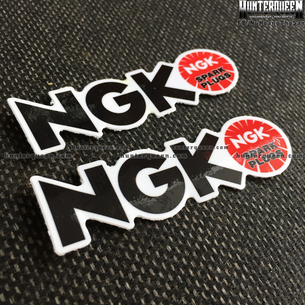 NGK[8.5X2.4cm] decal cao cấp chống nước, sắc nét, bền màu, dính chặt. Hình dán logo trang trí mọi nơi, in theo yêu cầu