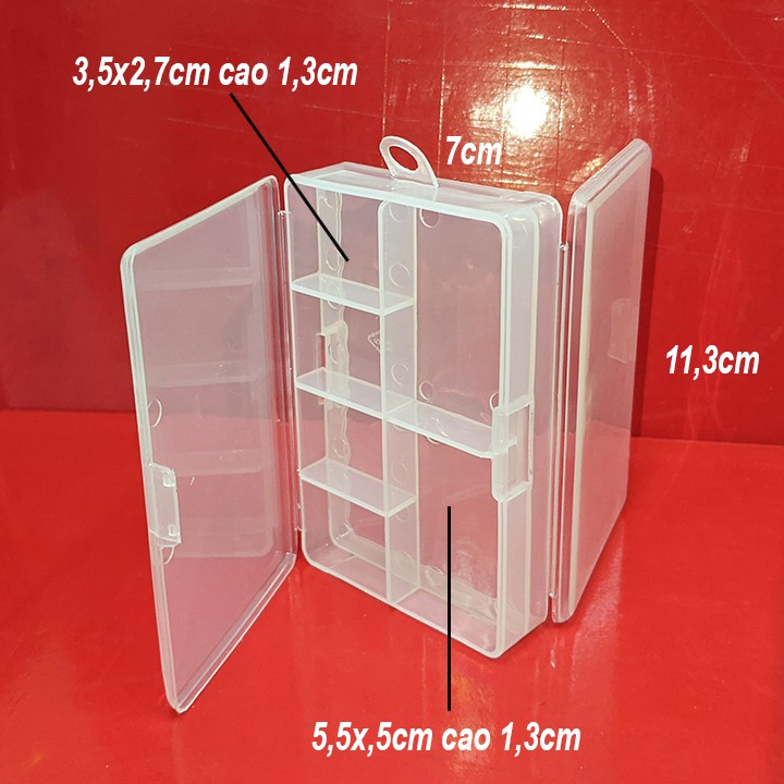 Hộp nhựa nhỏ nhiều ngăn, hộp thuốc 2 mặt với tổng cộng 7 ngăn và 2 nắp ở 2 mặt. 11,6x7,5cm cao 2,9cm. L410.