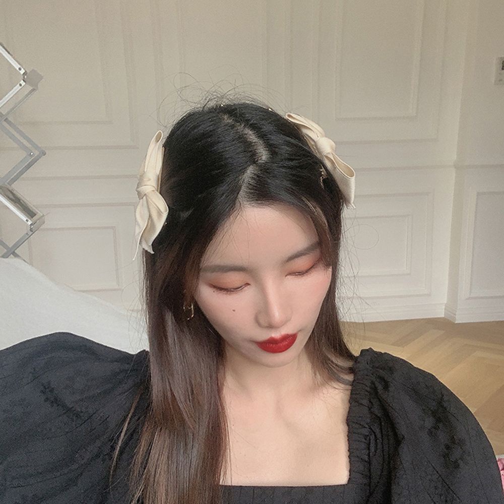 Kẹp tóc nơ đôi phối tua rua màu trơn phong cách Hàn Quốc dễ thương cho nữ