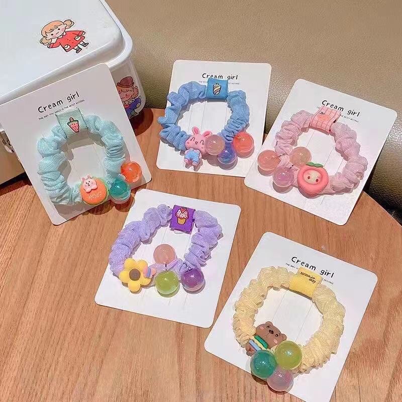 BUÔC TÓC NHÚNG ĐÍNH ICON PHỐI 3 HẠT CHÂU K518