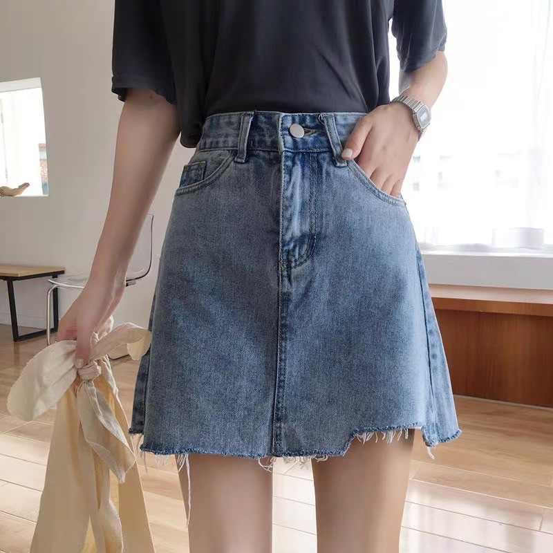 Chân váy xanh tua rua