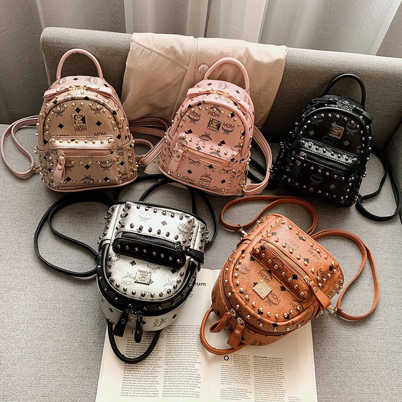 Đinh tán Mini Shoulder Bag Nữ 2020 Phiên bản tiếng Hàn mới của hàng trăm ba lô nhỏ Túi du lịch đa túi QI cao cấp