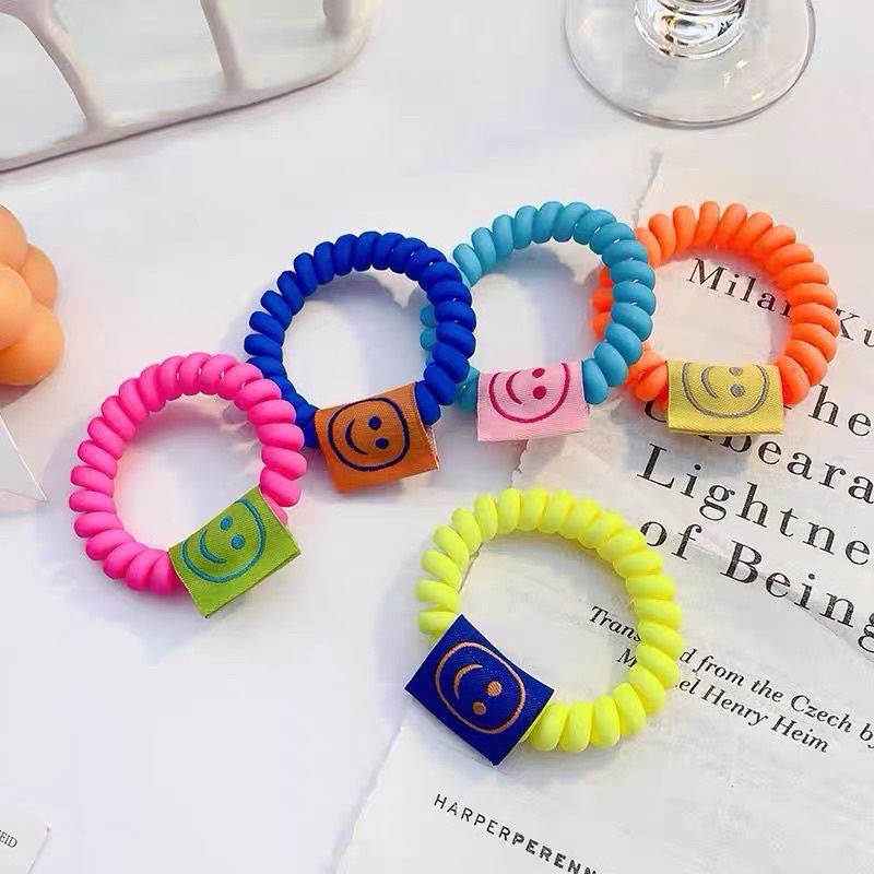 Cột tóc dây soắn maud neon hình mặt cười