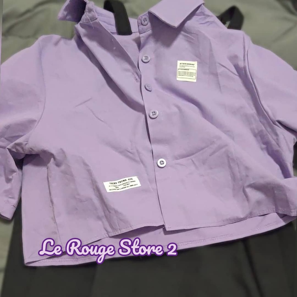 Set nữ thời trang gồm áo sơ mi tím dáng ngắn + váy yếm hai dây đen vạt chéo phong cách girl crush