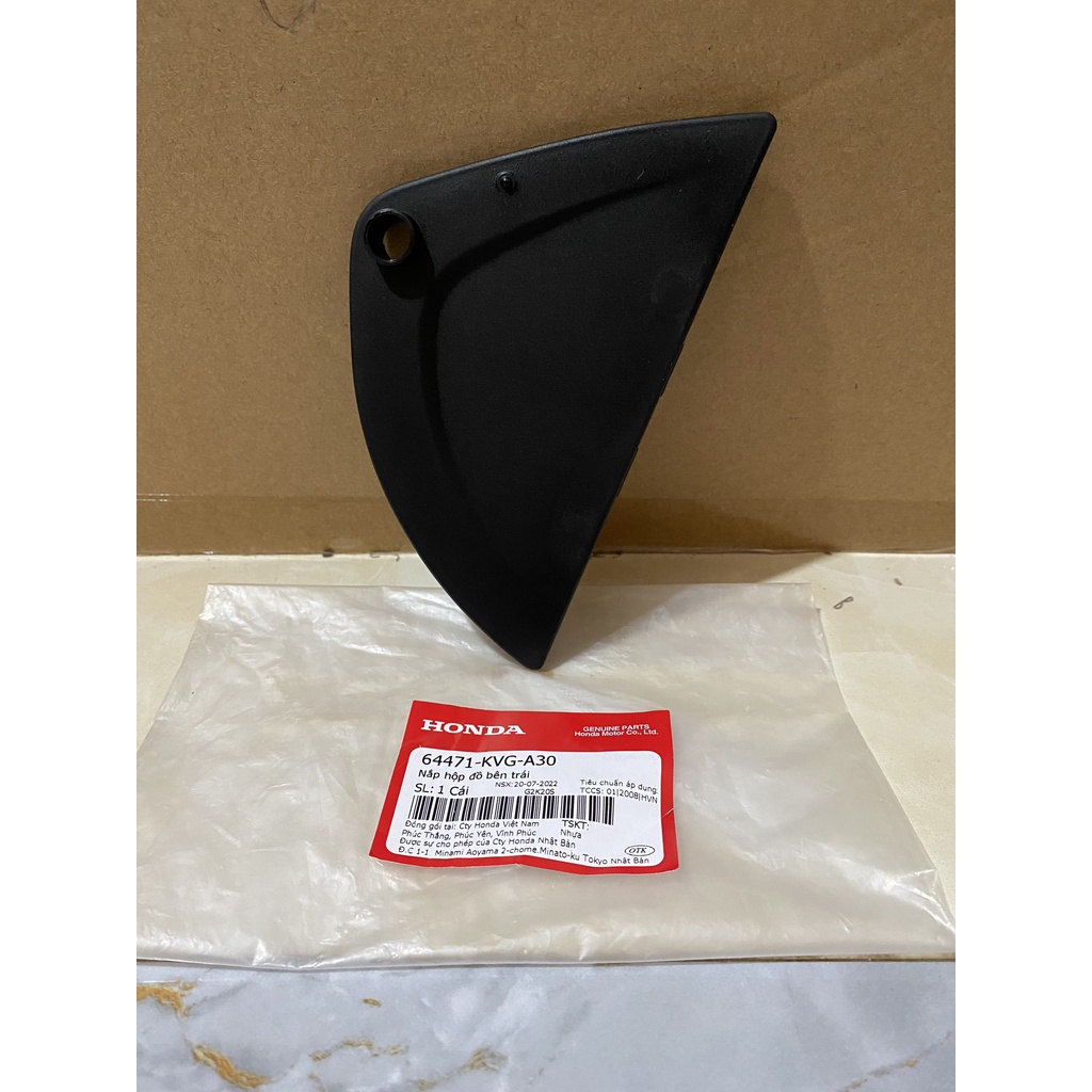 Nắp hộp đồ bên trái HONDA AIR BLADE 110 FI năm 2009-2010. 64471KVGA30