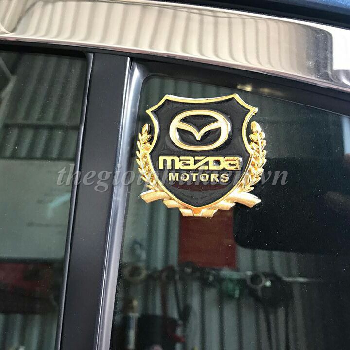 Bộ 2 Logo dạng Bông lúa theo xe- Mazda( hàng chất )( hàng chất )