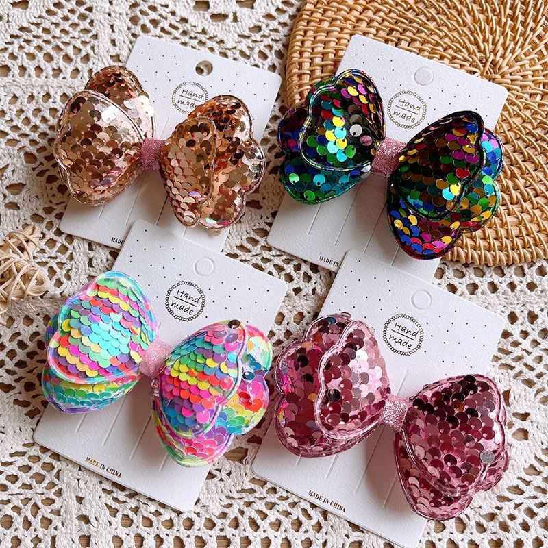 Kẹp tóc nơ đính kim sa xinh xắn cho bé