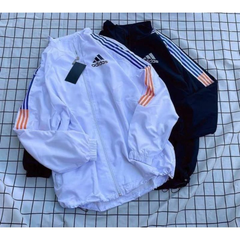Áo khoác logo adidass tay sọc xanh phối cam dù 2 lớp có dây rút gấu form rộng nam nữ