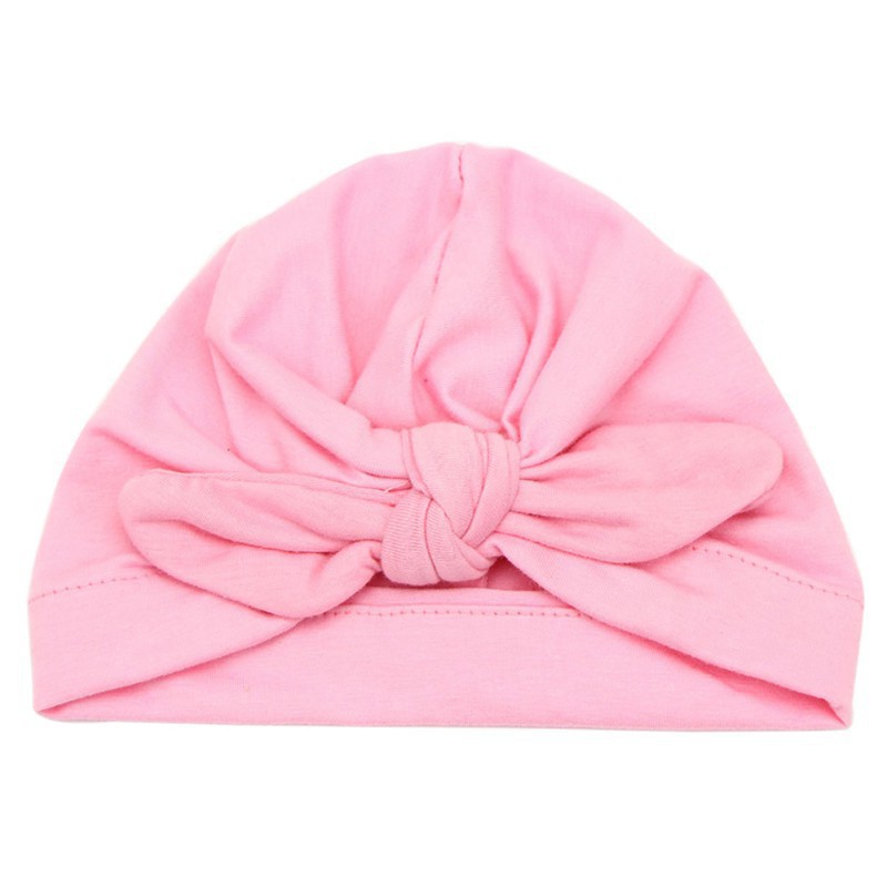 Mũ trùm đầu chất liệu cotton màu trơn thắt nơ bướm xinh xắn cho bé