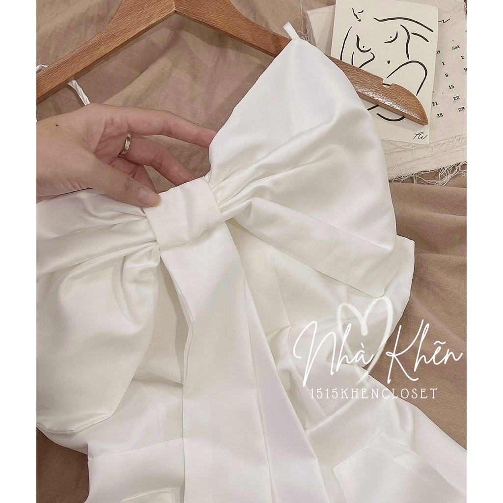 Đầm 2 dây mini trắng nơ ngực to