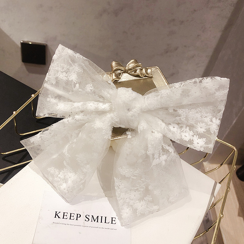 Kẹp tóc đính nơ phối ren xinh xắn cho bé
