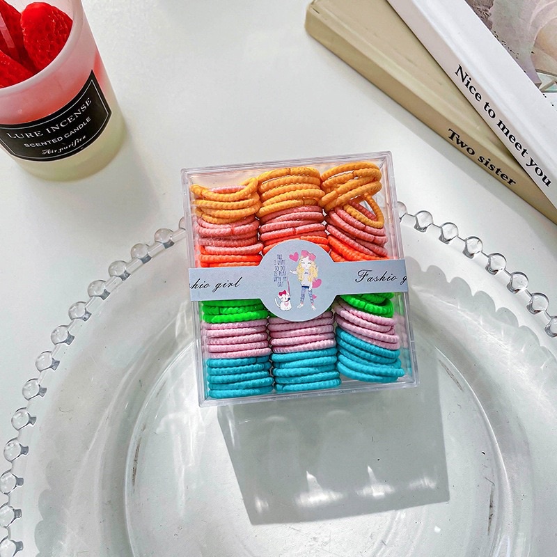 Hộp 100c chun buộc tóc bản nhỏ mix màu cho bé gái tiện lợi!