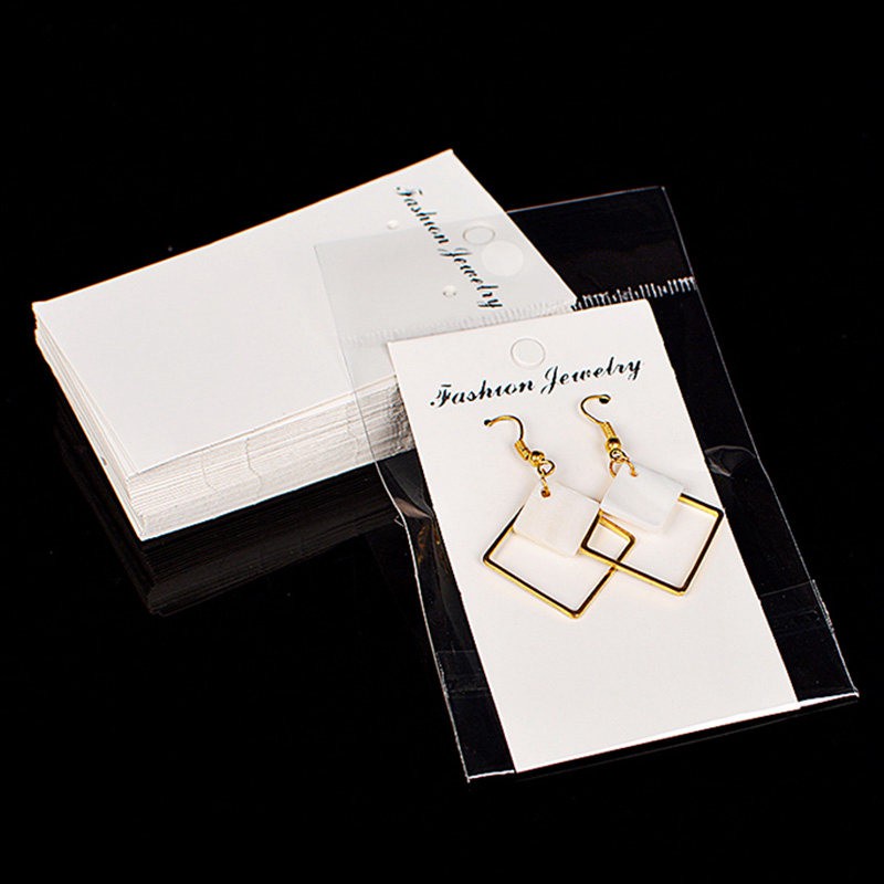 Set 100 túi tự dính và thẻ giấy màu trắng đựng trưng bày trang sức