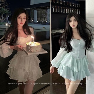Đầm xòe cổ tim tay phồng phối nút tầng