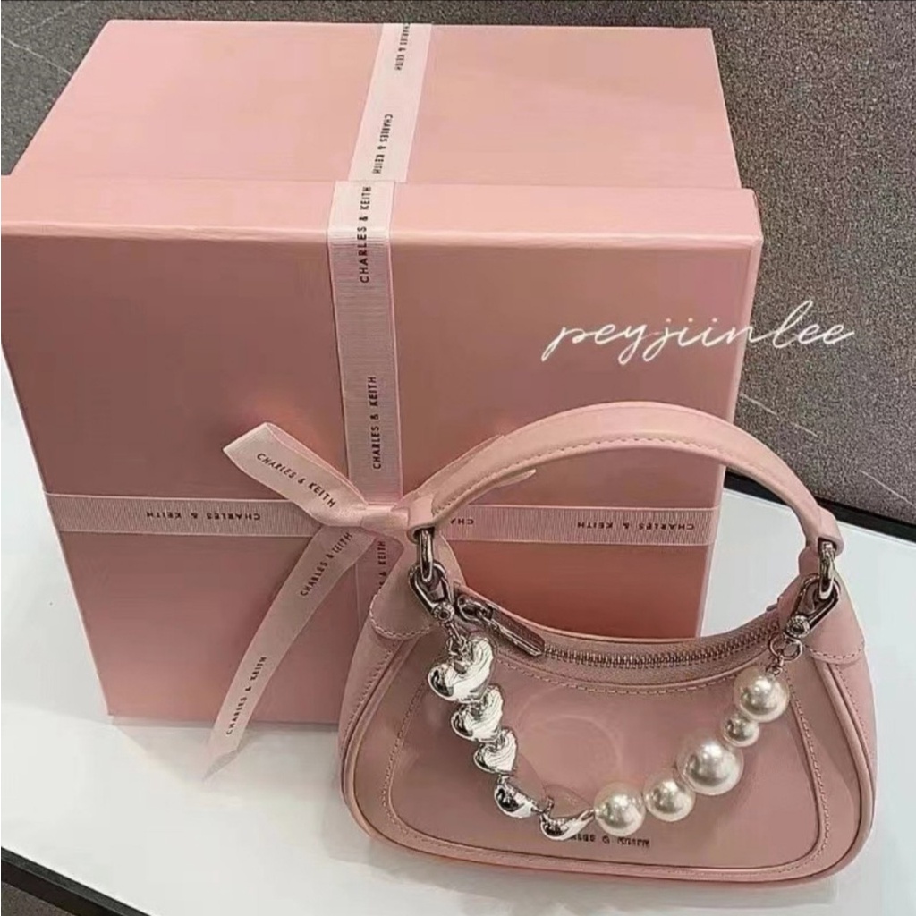 Túi cầm tay CnK màu hồng phối dây đeo hình trái tim và ngọc trai nhân tạo fullbox làm quà