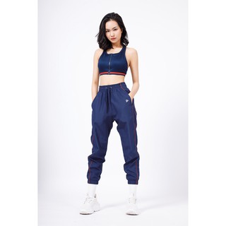 Quần dù thể thao Delta Nữ viền cam PA034W1- Chất liệu vải 100% polyester mát nhẹ.